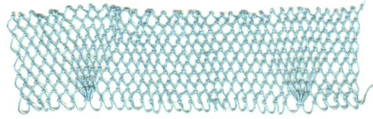row 10 of Pinecone Cluster netting stitch